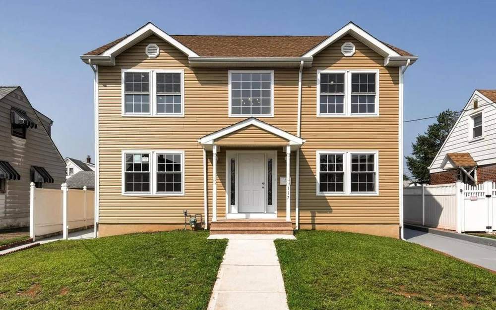 Completed new home — front exterior with landscaping