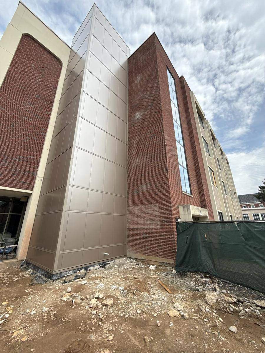 Completed elevator shaft — metal panel cladding