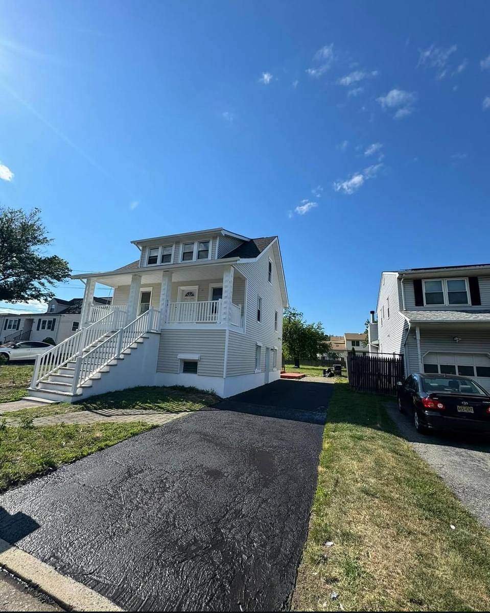 Completed exterior — front view with new driveway