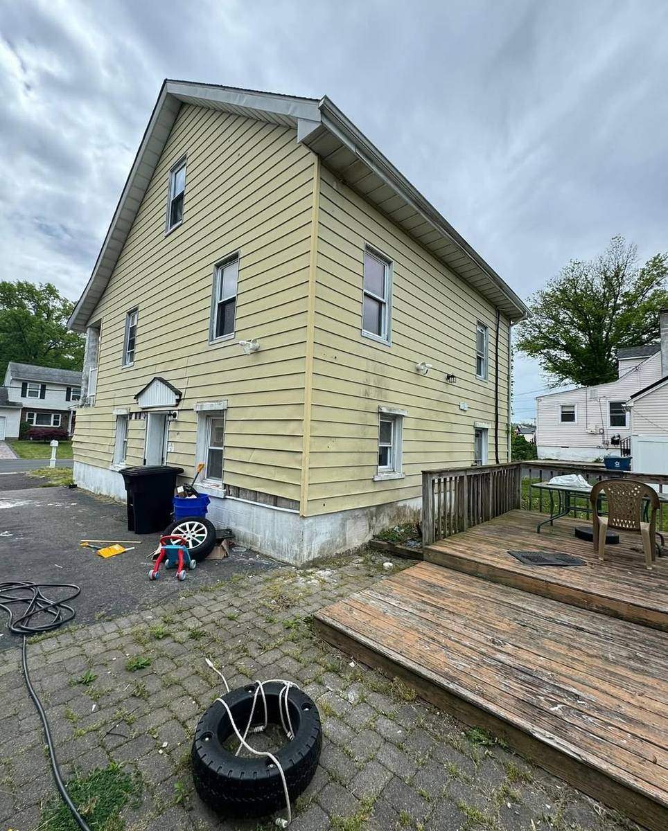 Before — old back siding and deck