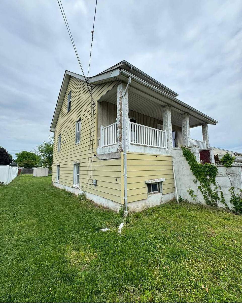 Before — yellow side siding